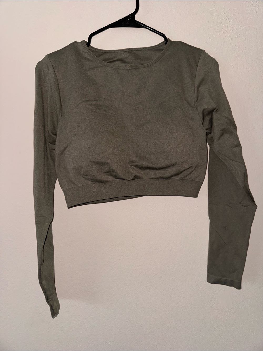 NVGTN Journey Long Sleeve Seamless Bra Top in the color Khaki Green. Size large